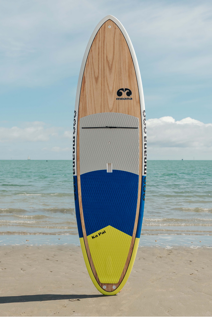 Moana Ka Pai blue green stand up paddleboard on the beach