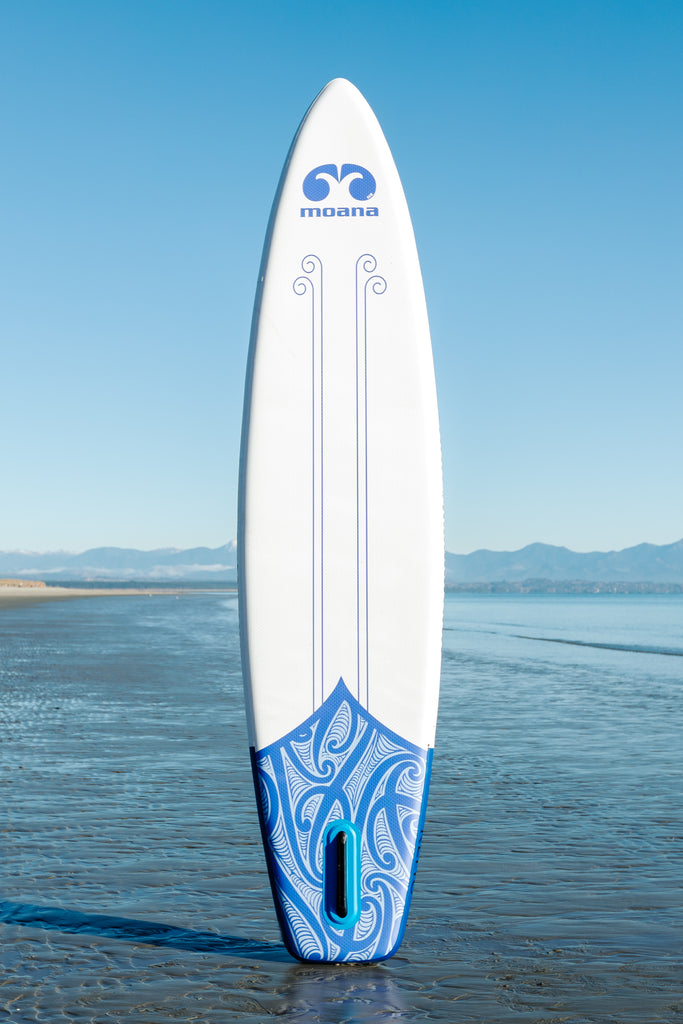 Moana Kehu 11' inflatable stand up paddleboard on the beach