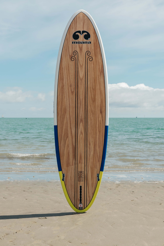 Moana Ka Pai blue green stand up paddleboard on the beach
