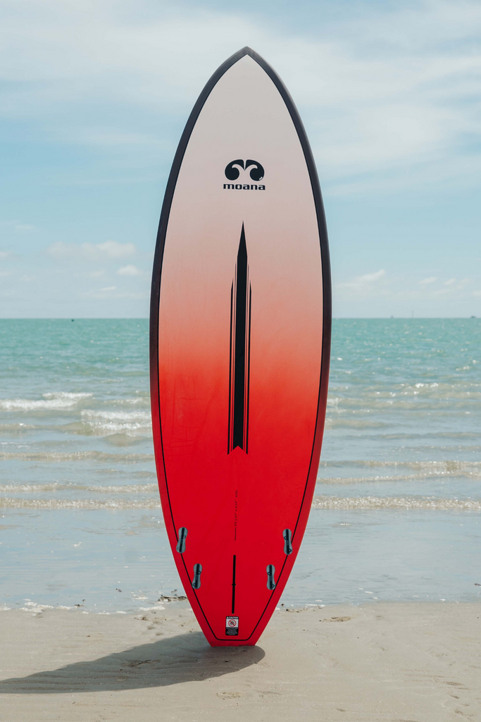 Moana Kahawai red surf stand up paddleboard on the beach