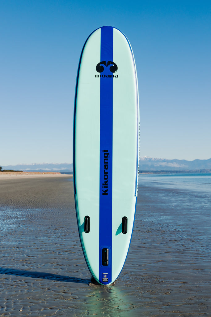 Moana Kikorangi 10'6" inflatable stand up paddleboard on the beach