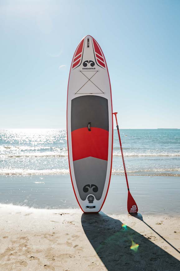 Moana Wananga max 11' inflatable stand up paddleboard on the beach