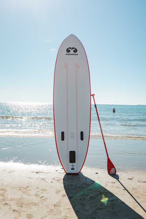 Moana Wananga max 11' inflatable stand up paddleboard on the beach