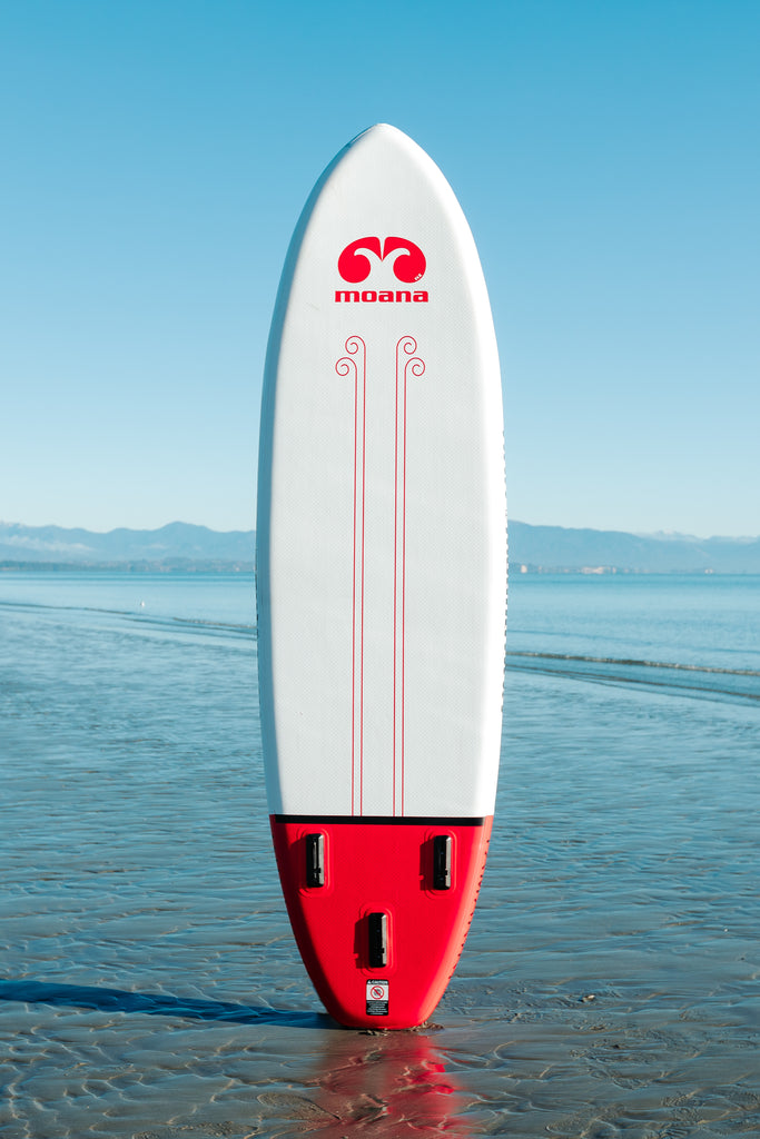 Moana tamariki 9' inflatable stand up paddleboard on the beach