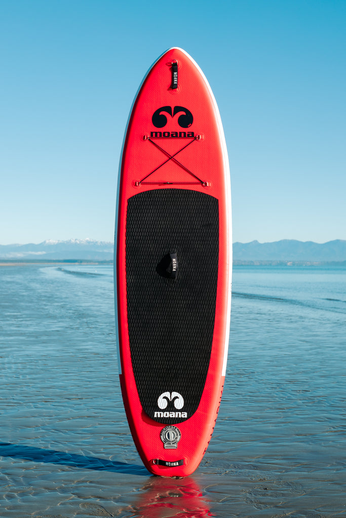 Moana tamariki 9' inflatable stand up paddleboard on the beach