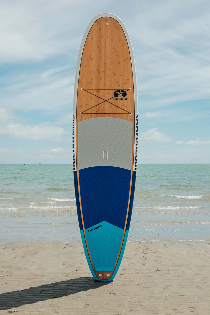 Moana Tumeke blue stand up paddleboard on the beach